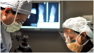 surgeon at work on operating stock photo